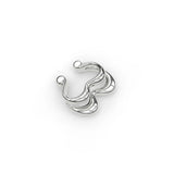 Sterling silver Heartbeat ear cuff, angled top-down shot while laying flat.